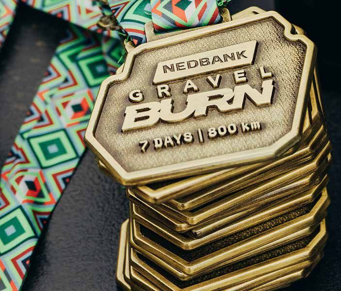 A stack of Nedbank Gravel Burn finisher medals