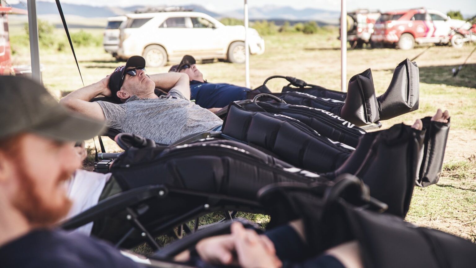 Riders recovering in Hyperice compression boots
